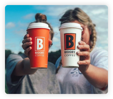 two cups of biggby coffee